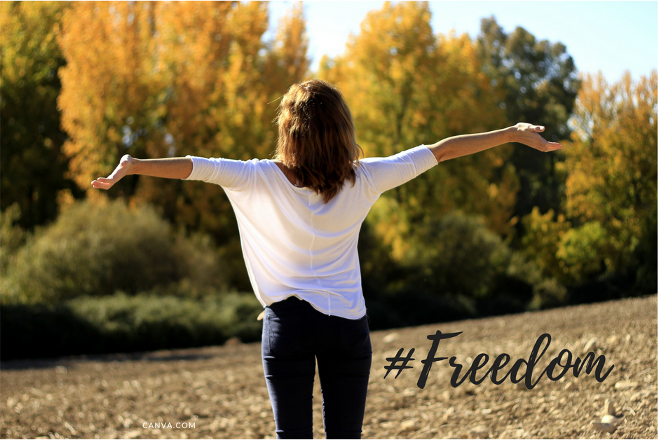 #Freedom-Lady standing in the sun with open arms, feeling free